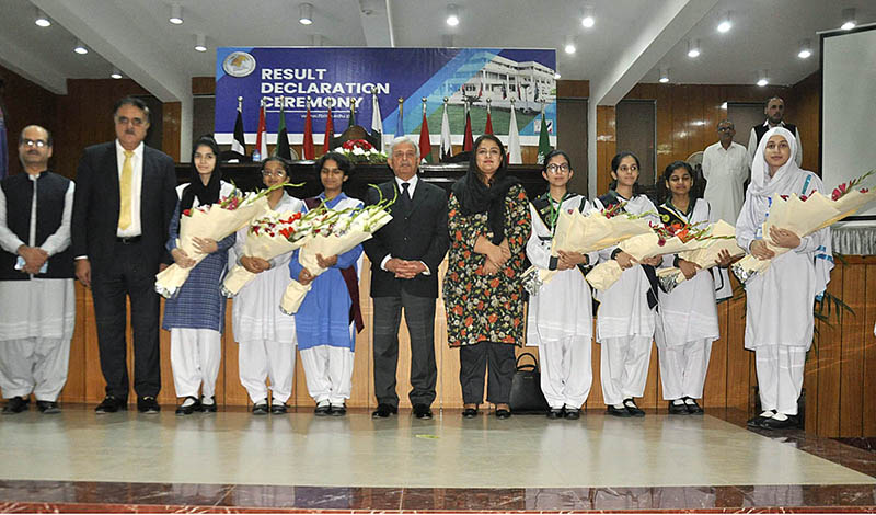 Federal Minister for Education and Professional Training Rana Tanveer Hussain group photo with position holders during the Result Declaration ceremony SSC Part I&II 1st Annual Exam 2023 at FBISE