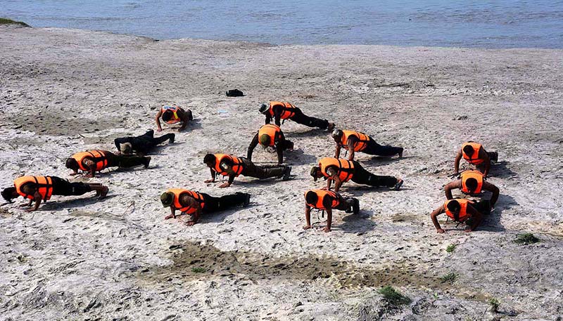 Rescue 1122 workers busy in physical exercise before mock exercise at Kabul River