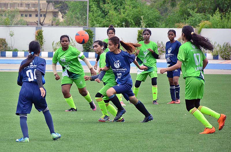 Females players of Sukkar and Larkana Football Teams are in action during Prime Ministers Talent Hunt Youth Sports League at Public School Ground