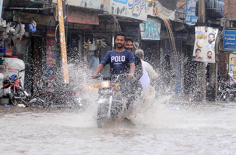 A woman on the way under cover of an umbrella to protect from rain that experience the city