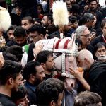 Mourners touch Zuljinah during the main procession of 9th Muharram-ul-Haram observing Youm-e-Ashur. Muharram ul Harram, the first month of the Islamic calendar is known as the mourning month to pay homage in remembrance of the martyrdom (Shahadat) of Hazrat Imam Hussain (AS), the grandson of the Holy Prophet Mohammad (SAWW), along with his family members and companions at the battle of Karbala