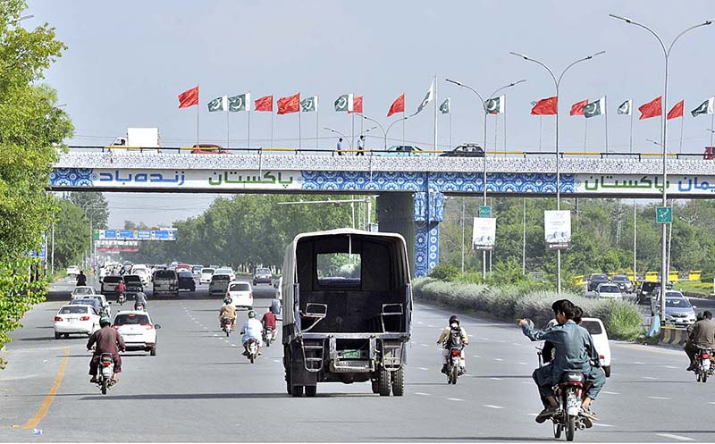 Billboard and Pak-China flags are being displayed at Srinagar Highway in connection with 10 years celebration of CPEC