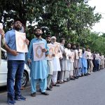People from different walks of life making Quran Chain organize by the Muslim Talba Mahaz Pakistan at Abpara against the desecration of Holy Quran in Sweden