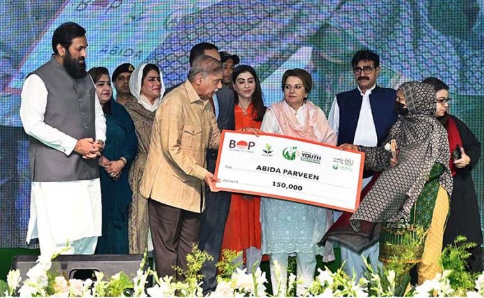 Prime Minister Muhammad Shehbaz Sharif distributing cheques among the recipients of Prime Minister's Youth Business and Agriculture Loan Scheme