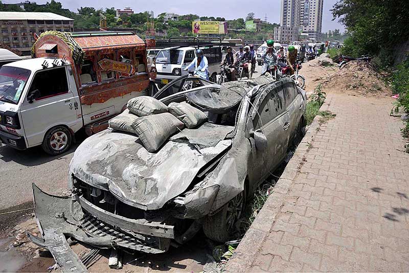 View of badly damaged vehicles struck by an out of control Dumper Truck near Lahore High Court Bench at Swan area in the outskirts of the city