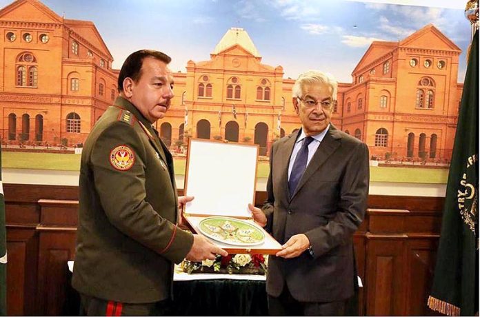 H.E. Sher Ali Mirzo, Defence Minister of Tajikistan presenting a souvenir to Defence Minister, Khawaja Muhammad Asif at Ministry of Defence