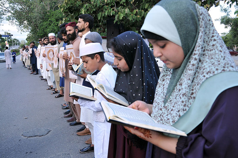 People from different walks of life making Quran Chain organize by the Muslim Talba Mahaz Pakistan at Abpara against the desecration of Holy Quran in Sweden