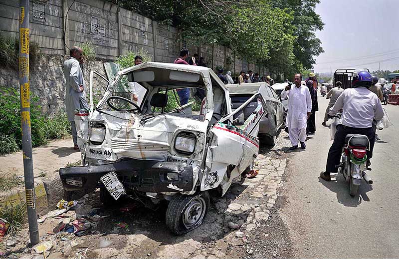 View of badly damaged vehicles struck by an out of control Dumper Truck near Lahore High Court Bench at Swan area in the outskirts of the city