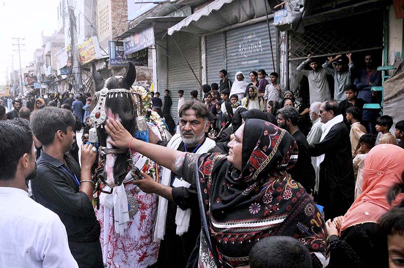 A large number of mourners attend the 10th Muharram procession to mark Ashoura. Ashoura is the commemoration marking the Shahadat (death) of Hussein (AS), the grandson of the Prophet Muhammad (PBUH), with his family members during the battle of Karbala for the upright of Islam