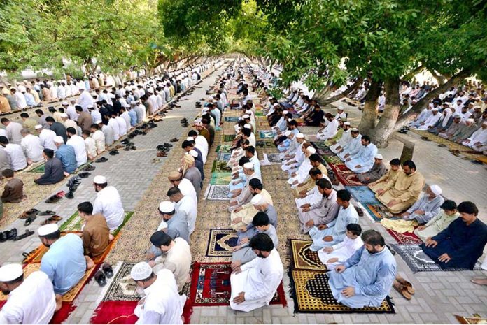 People offer Eid prayer on the occasion of 1st day of Eid-ul-Azha at Eidgah located on Charsadda Road.