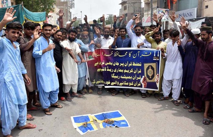 Members of civil society take part in a protest demonstration in front of press club against the burning of Holy Quran outside a Stockholm mosque in Sweden