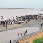 A large number of people enjoying cloudy weather at Indus River