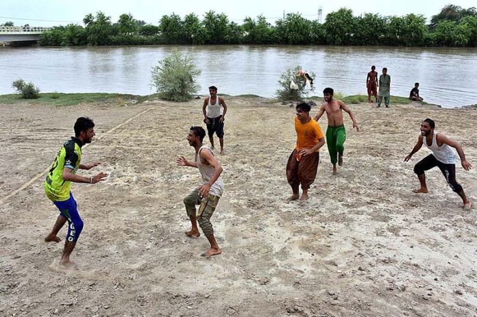 Youngsters in action during Kabaddi game near Rice Canal