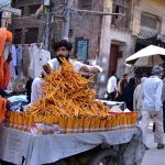 A vendor displaying the stationary items pencils to attract the customers outside the Data gunj Buksh Road