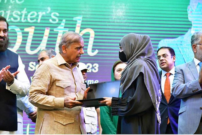 Prime Minister Muhammad Shehbaz Sharif distributes laptops among the high achievers of public sector universities under the PM's Youth Laptop Scheme at Bahauddin Zakaria University