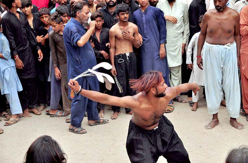 Mourners flagellate themselves with knifes on chains during the 10th Muharram procession to mark Ashoura. Ashoura is the commemoration marking the Shahadat (death) of Hussein (AS), the grandson of the Prophet Muhammad (PBUH), with his family members during the battle of Karbala for the upright of Islam