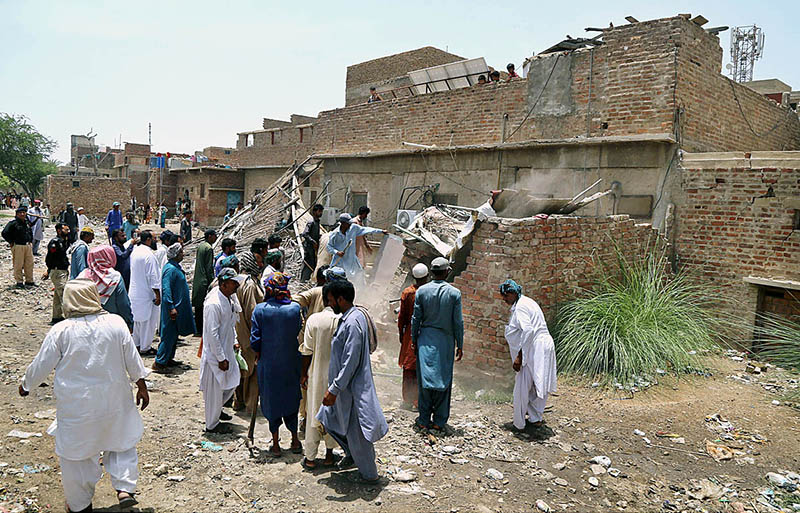 Railway staffers of Anti-Encroachment Cell demolishing encroachments at Makki Shah area