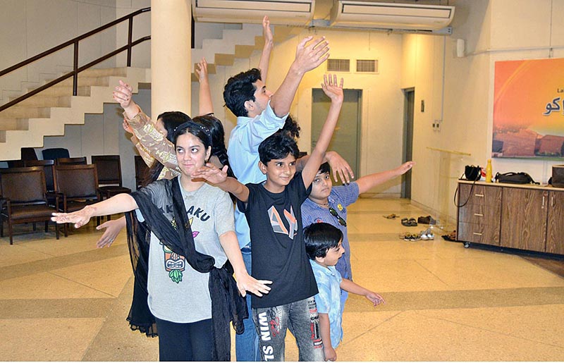 Children performing while rehearsal for drama during the Act Performance Summer Camp