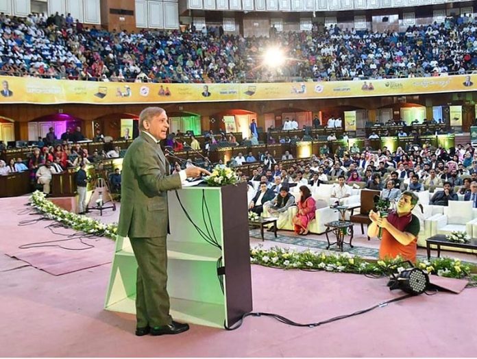 Prime Minister Muhammad Shehbaz Sharif addressing a ceremony to provide merit-based laptops to the youth of public sector universities under the Prime Minister's Youth Laptop Scheme at Jinnah Convention Centre