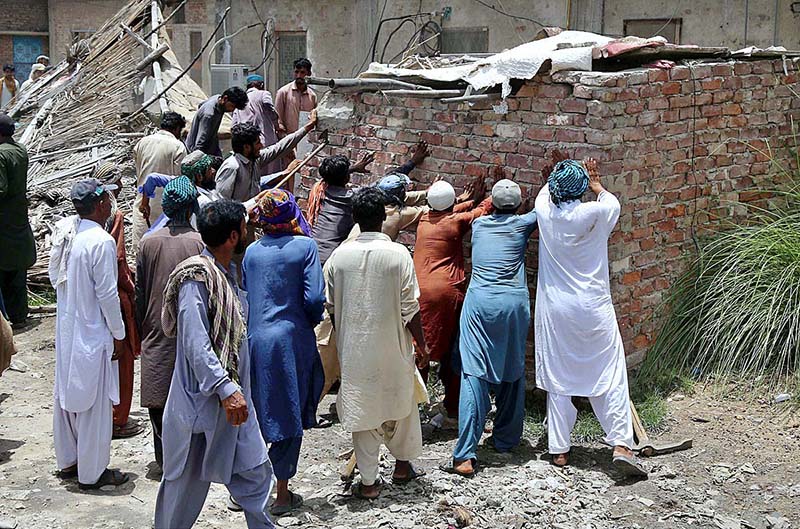 Railway staffers of Anti-Encroachment Cell demolishing encroachments at Makki Shah area