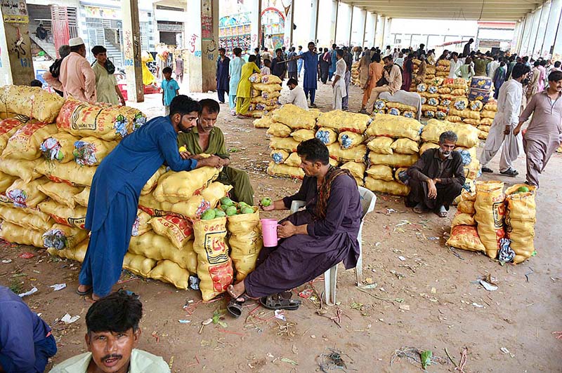Vendors displaying the mangoes to attract the customers at Fruits Market