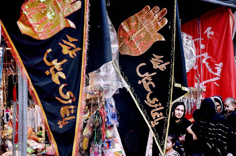 Shopkeeper displays Muharram-ul-Harram related stuff to attract the customer at Bibi Pak Daman