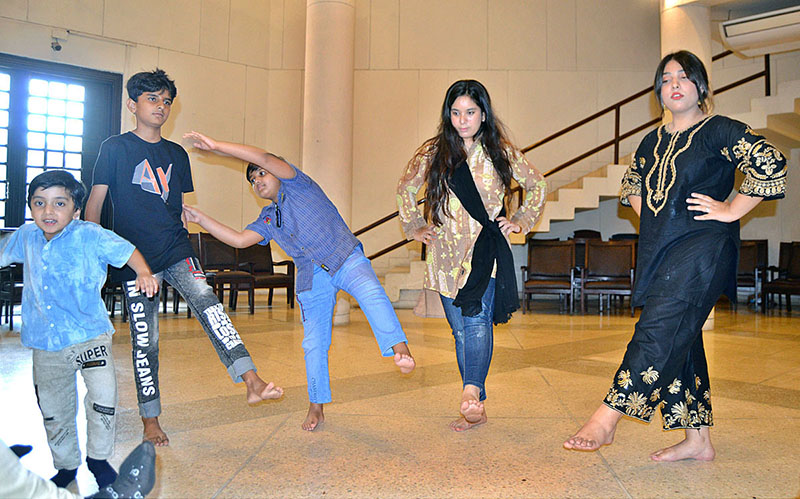 Children performing while rehearsal for drama during the Act Performance Summer Camp