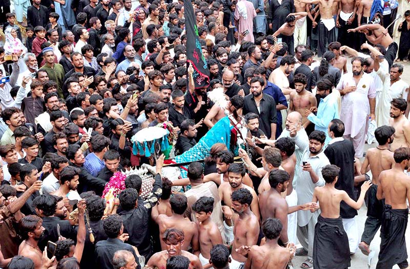 Mourners flagellate themselves with knifes on chains during the 10th Muharram procession to mark Ashoura. Ashoura is the commemoration marking the Shahadat (death) of Hussein (AS), the grandson of the Prophet Muhammad (PBUH), with his family members during the battle of Karbala for the upright of Islam