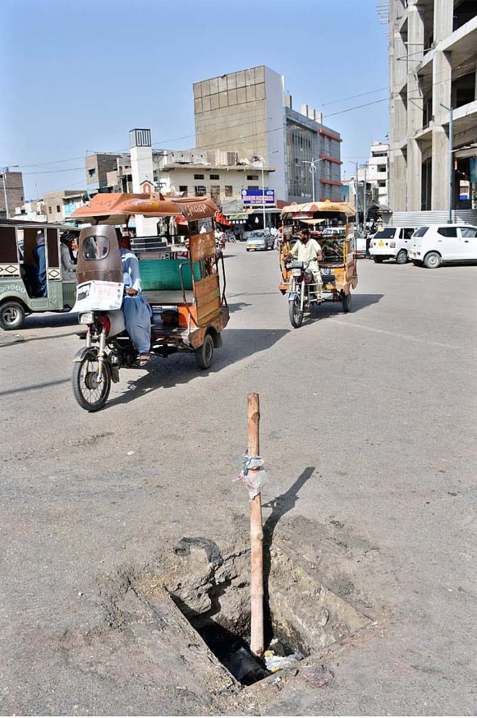 A view of open manhole on the road of Al Abbas Chowk