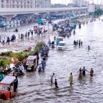 A view of accumulated water on a road after heavy Rain in the Surjani Town area of metropolis