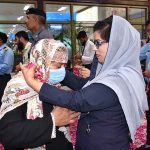 Officers welcoming the pilgrims of the first flight returning after performing the duty of Hajj