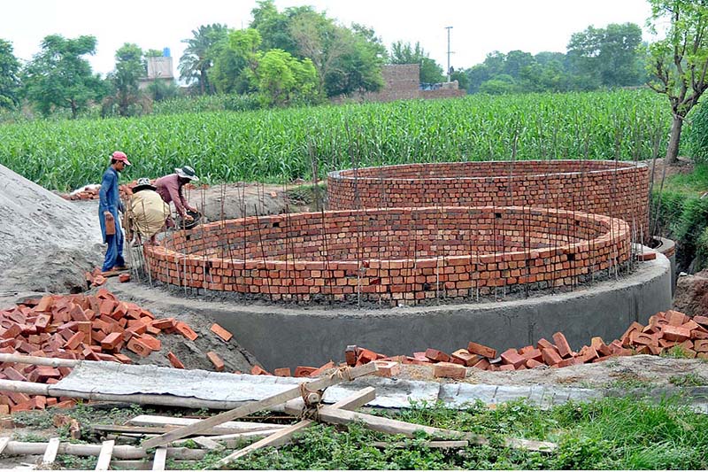 Laborers busy in construction work of sewage manhole at Suraj Miani