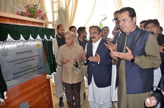 Prime Minister Muhammad Shehbaz Sharif is offering “Dua” after unveiling the plaque during groundbreaking ceremony for dualization of a road from Faisalabad Bypass to Motorway (M-3) via Satiana