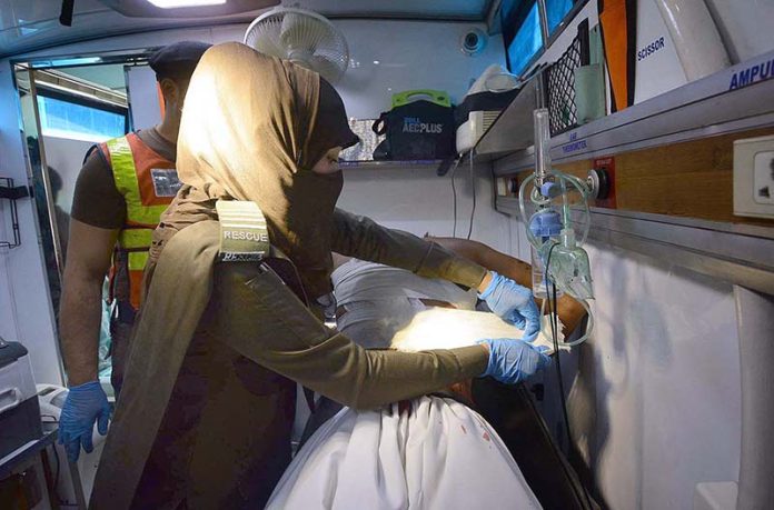 1122 female medical officer giving first aid to mourners during Zuljinnah procession on 9th Muharram ul Harram at Sadar Bazaar