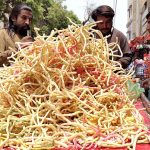 Vendor selling traditional food items at Jinnah Bagh Chowk
