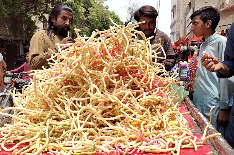 Vendor selling traditional food items at Jinnah Bagh Chowk