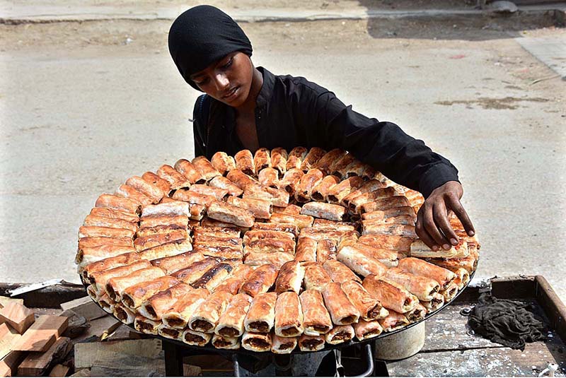 An elder worker busy in work at the a local bakery