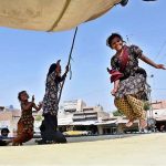 Girls enjoying on jumping-jack at Nazar Muhalla