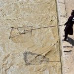 A man is fishing with net at Rice Canal in the city