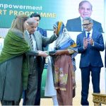 Prime Minister Muhammad Shehbaz Sharif distributing smart cards and cheque books relating to Benazir Social Protection Account among the beneficiaries