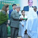 Prime Minister Muhammad Shehbaz Sharif distributing smart cards and cheque books relating to Benazir Social Protection Account among the beneficiaries