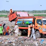 SSWMB workers are dumping garbage in dumping garbage area at Latifabad