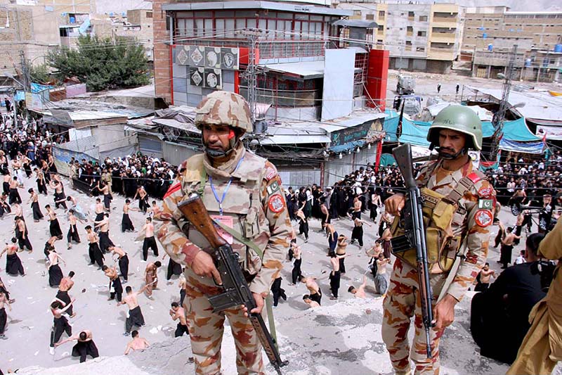 Security personnel high alert during the main procession of 10th Muharram-ul-Haram. Ashoura is the commemoration marking the Shahadat (death) of Hussein (AS), the grandson of the Prophet Muhammad (PBUH), with his family members during the battle of Karbala for the upright of Islam