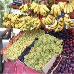 A vendor displaying fruits to attract the customers at Sheikh Zaid Women Hospital Road