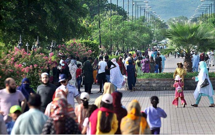 A large number of people visiting Rawal Lake View Park in a pleasant day in the city