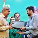 Prime Minister Muhammad Shehbaz Sharif distributes laptops among the high achievers of public sector universities under the PM's Youth Laptop Scheme at Bahauddin Zakaria University