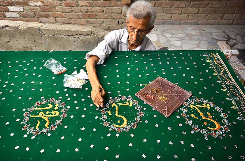 An old man preparing Muharram Procession related stuff in connection with the Holy Month of Muharram ul Harram