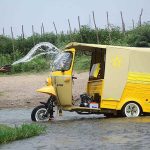 A person washing his vehicle in a stream at Dando Pull near Phandu area