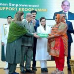 Prime Minister Muhammad Shehbaz Sharif distributing smart cards and cheque books relating to Benazir Social Protection Account among the beneficiaries