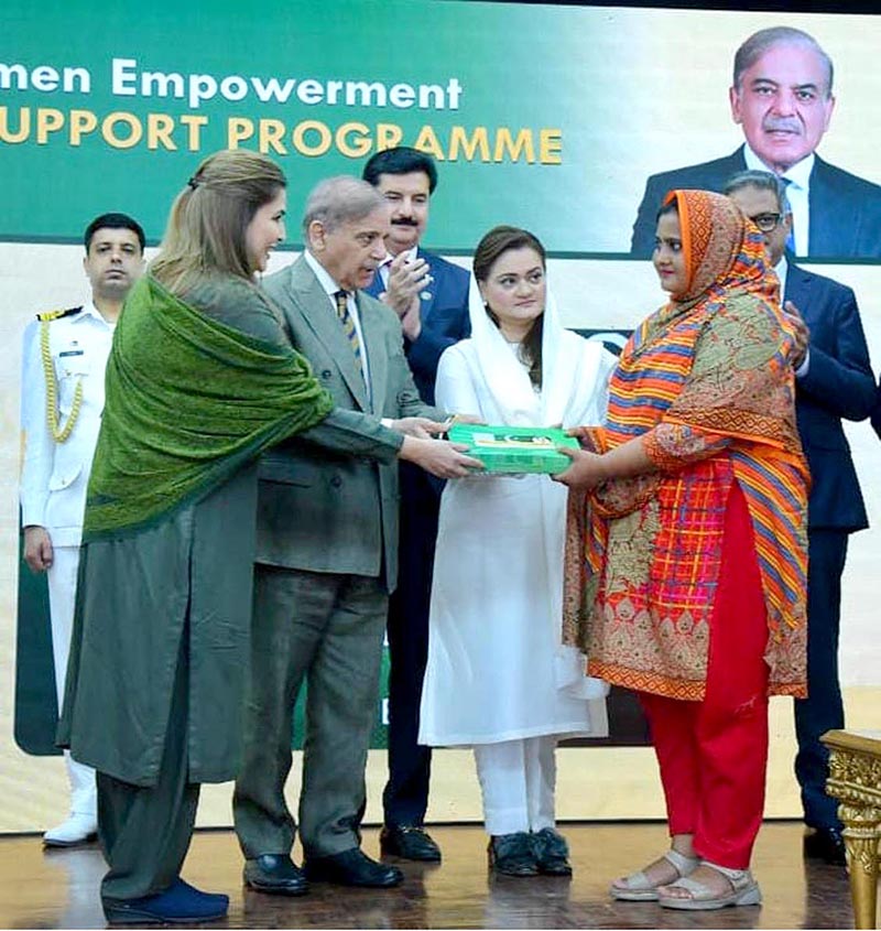 Prime Minister Muhammad Shehbaz Sharif distributing smart cards and cheque books relating to Benazir Social Protection Account among the beneficiaries